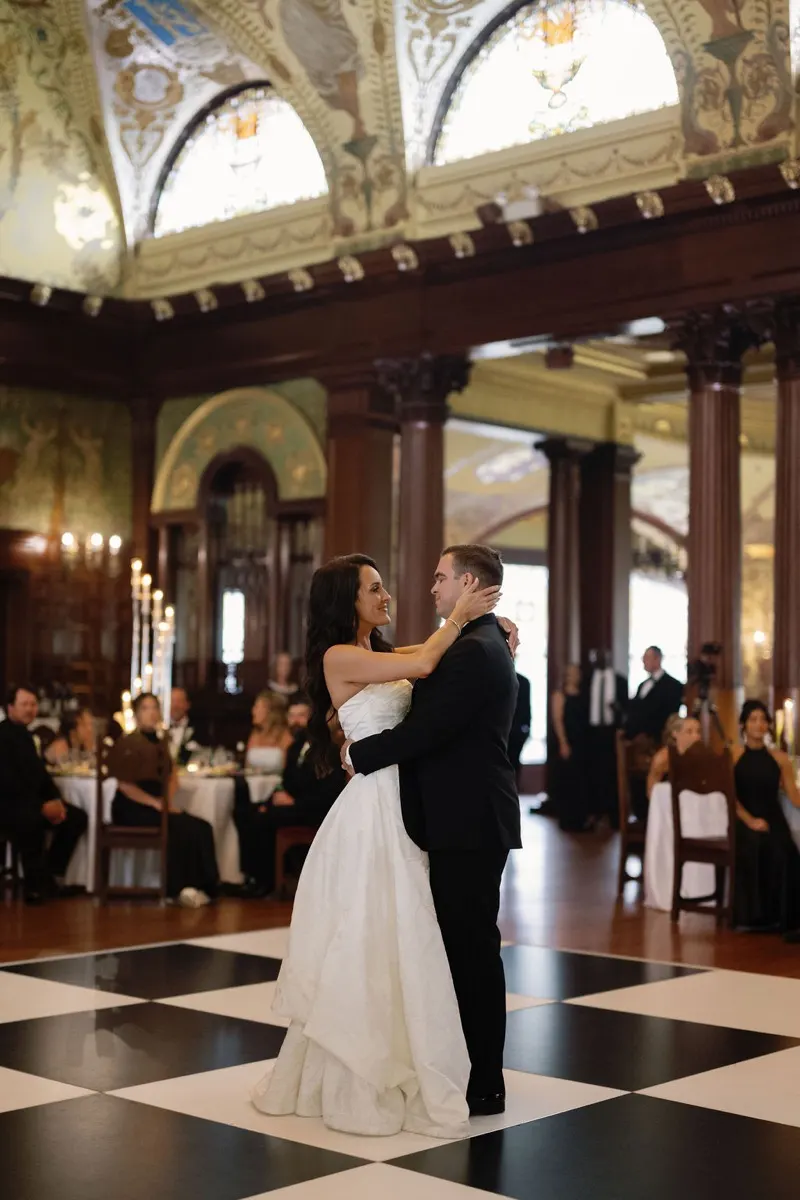 First dance on the checkered floor under frescoed ceiling at Flagler College Ponce Dining Hall wedding reception