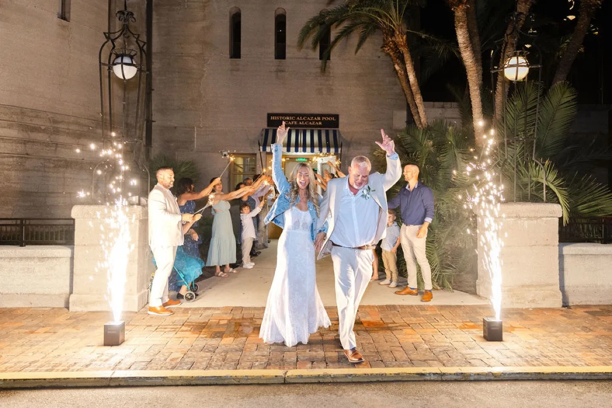 Sparkler send-off at the Alcazar door with cold-spark fountains