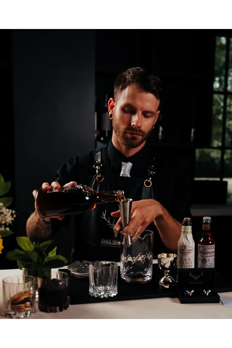 A McKarls bartender building a craft cocktail