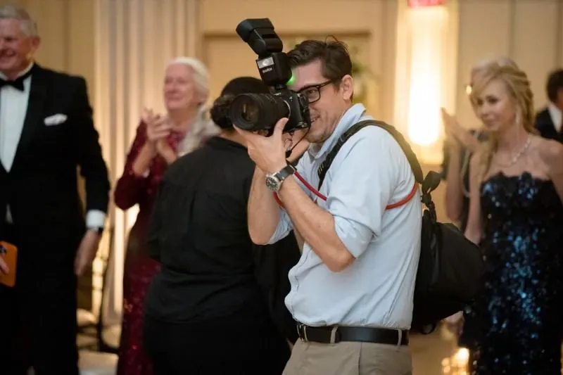 Rob Futrell photographing a wedding reception