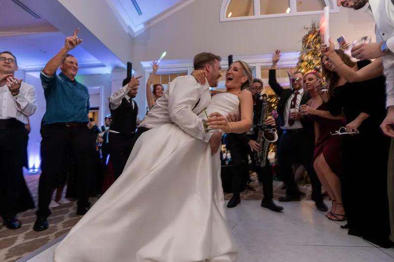 Saxophonist playing on a packed wedding dance floor at Sawgrass Country Club
