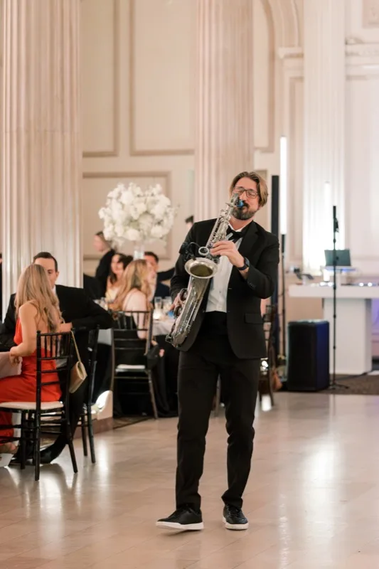Live saxophonist performs at Treasury on the Plaza wedding reception